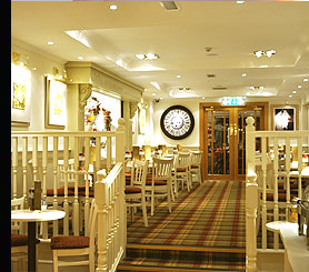 Downlights, Chandeliers and concealed LED Colour Changing Strip Lighting installed in a Restaurant