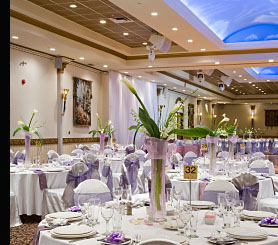 A hotel function suite featuring energy saving downlights, wall lights, concealed ceiling lighting and colour co-ordinated background music speakers